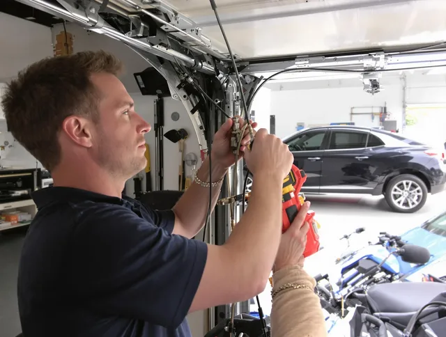 East Lyme Garage Door Repair safety certified technician performing cable replacement in East Lyme