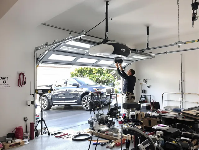 East Lyme Garage Door Repair specialist installing smart garage door opener system in East Lyme home